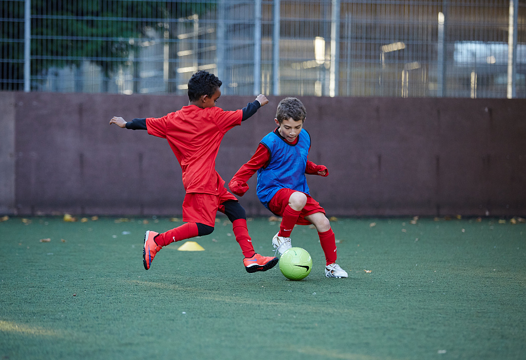 Boys playing football