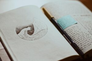 Notebook with a sketch of a wave