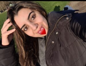 Selfie photo with a red heart emoji on the face
