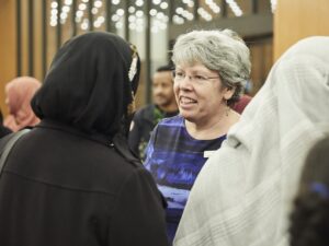 photo of two people talking at an awards ceremony