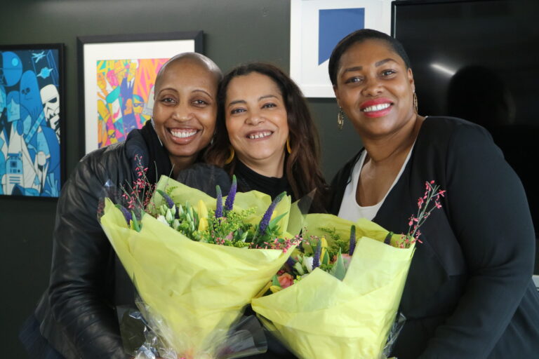 IWD celebration with women holding Flowers