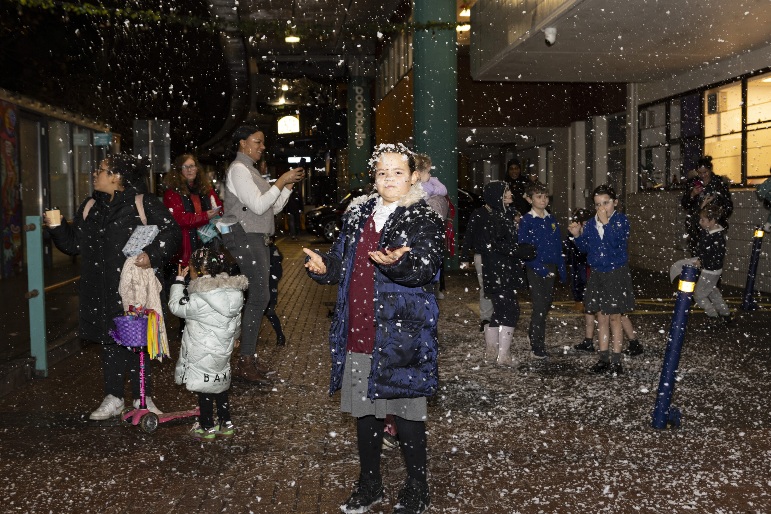 Children playing in snow under Westway