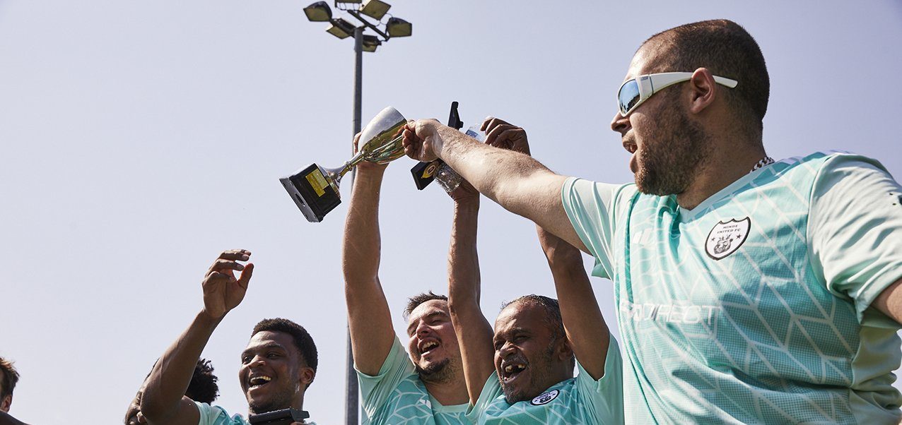 Minds United FC lift trophy