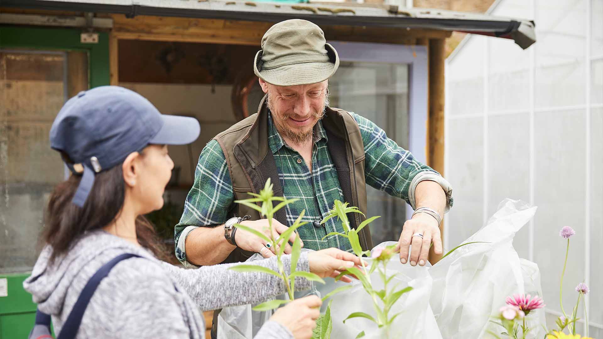 John Broadbent gardening with volunteer