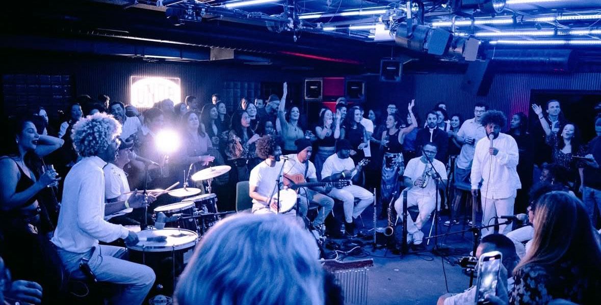 Band playing to crowd at UNDR