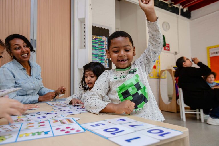 Children at nursery smiling