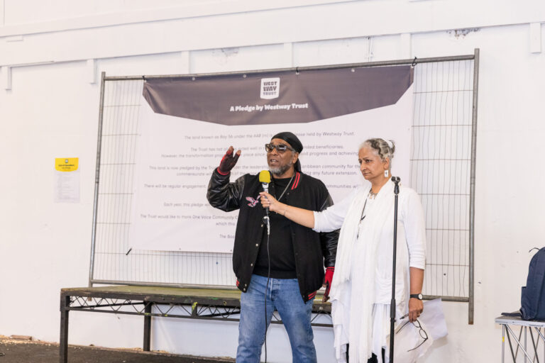 Venu holding microphone as public passionately speak at pledge